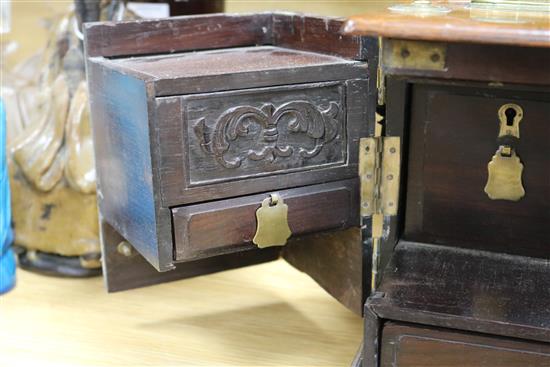 A Chinese brass mounted hardwood box, fitted numerous compartments